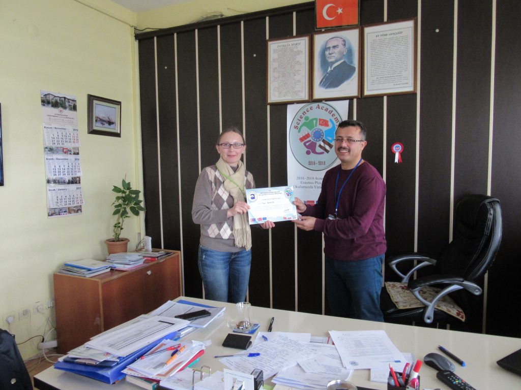 69. Ali Çetinkaya Ortaokulu school’s headmaster giving the certificate to Latvian coordinator